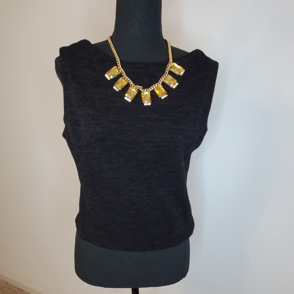 Dark grayish black crop top with leather cutout